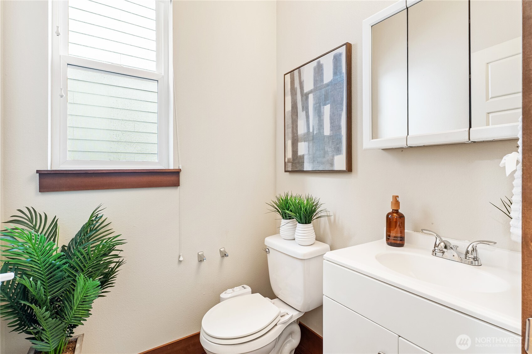 20304 3rd Drive Southeast Bothell, WA 98012 - Photo 4 of 31 a white toilet sitting next to a bathroom sink
