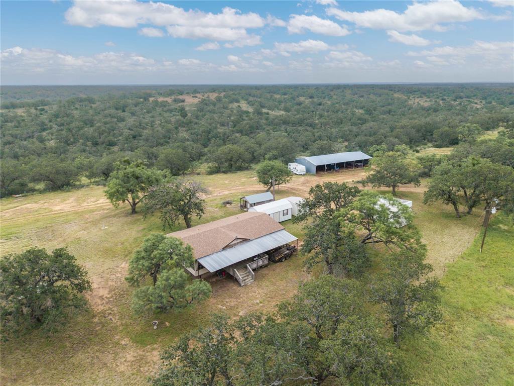 11814 County Road 266 Rochelle, TX 76872 - Photo 20 of 40 a view of a lake with a building in the background
