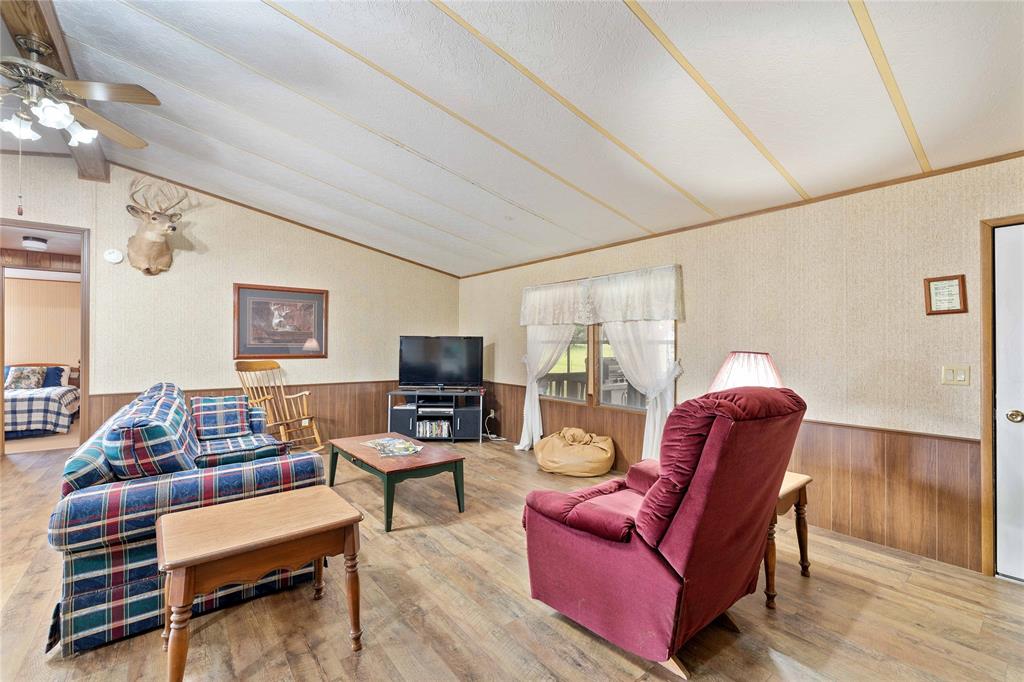 11814 County Road 266 Rochelle, TX 76872 - Photo 22 of 40 a living room with furniture a flat screen tv and a window