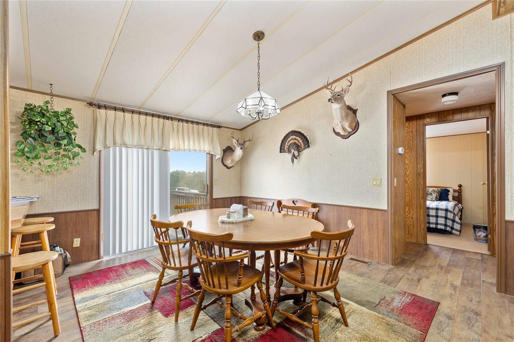 11814 County Road 266 Rochelle, TX 76872 - Photo 25 of 40 a view of a dining room with furniture window and wooden floor