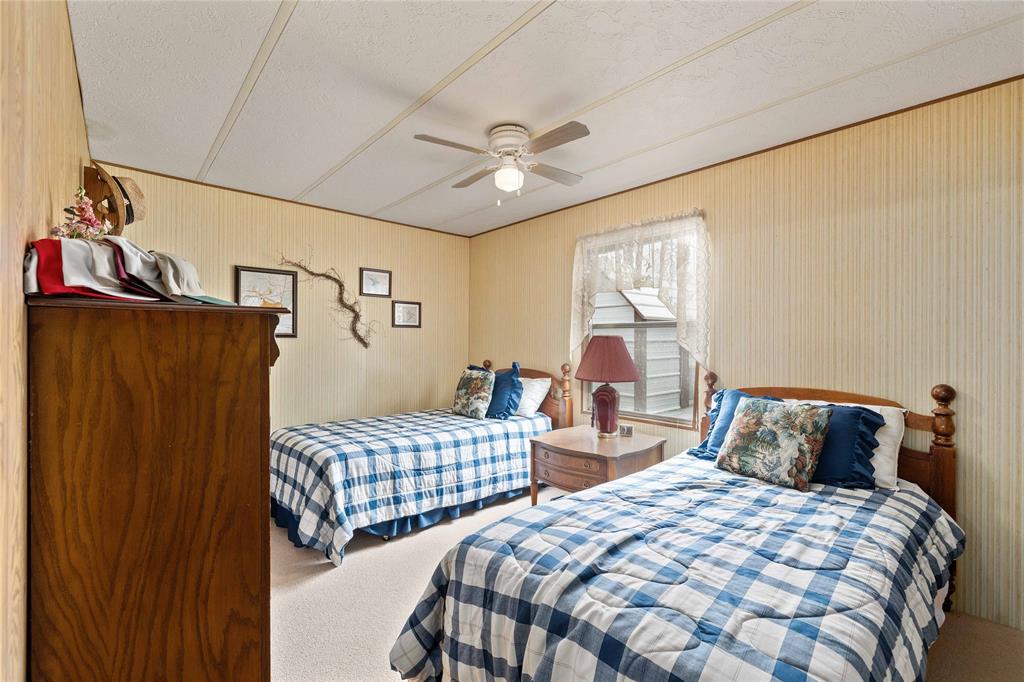 11814 County Road 266 Rochelle, TX 76872 - Photo 27 of 40 a bedroom with two beds and a window