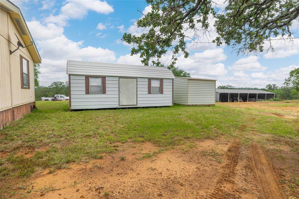 11814 County Road 266 Rochelle, TX 76872 - Photo 31 of 40 a front view of house with yard and trees around