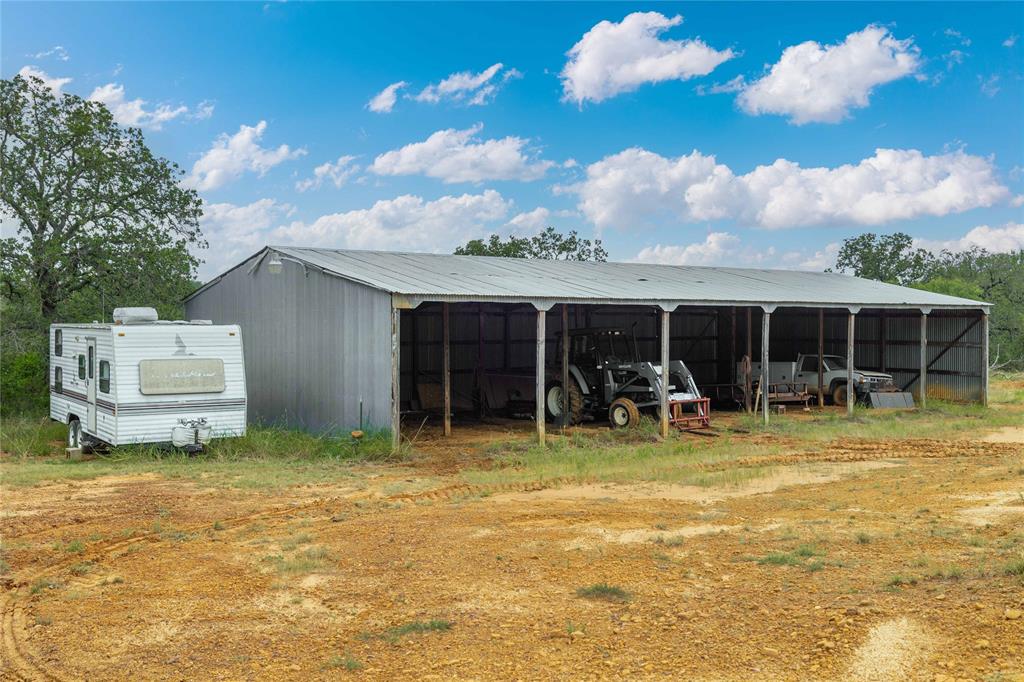 11814 County Road 266 Rochelle, TX 76872 - Photo 33 of 40 a backyard of a house with table and chairs