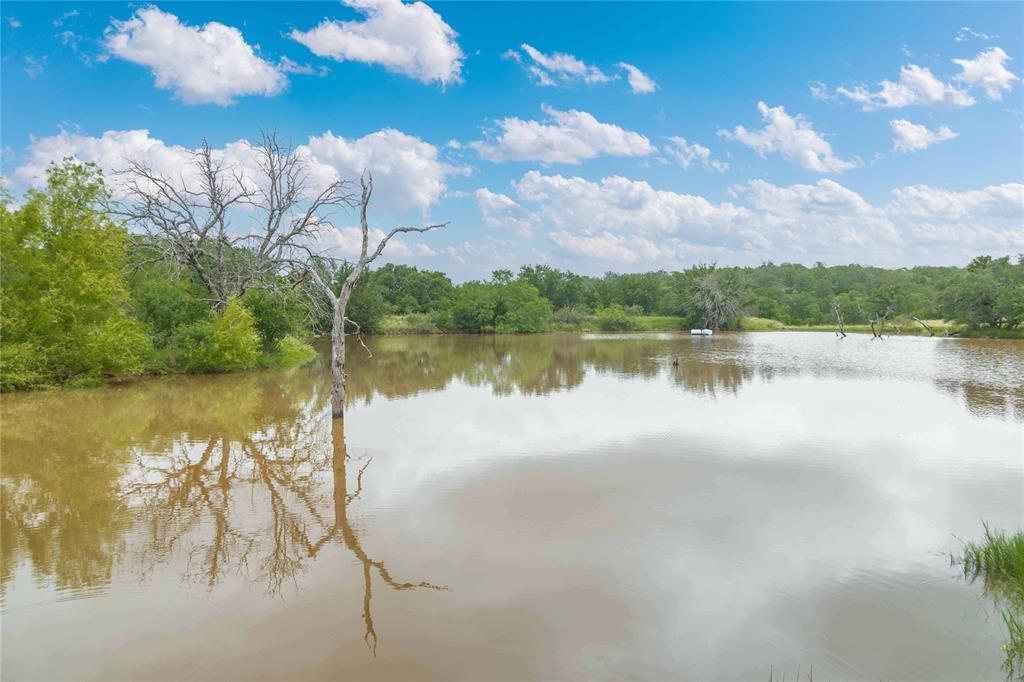 11814 County Road 266 Rochelle, TX 76872 - Photo 36 of 40 a view of a lake with houses in the back
