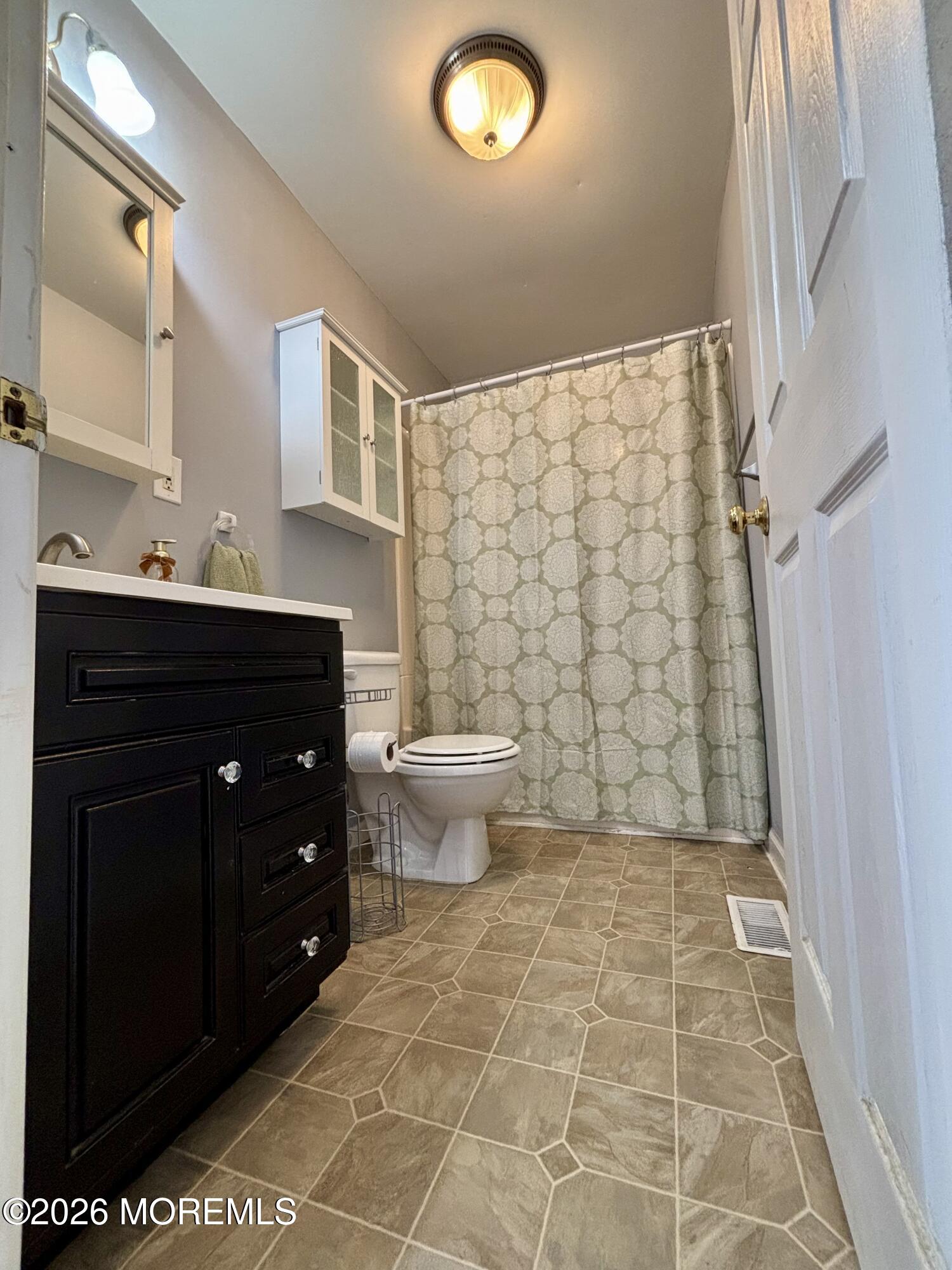 159 Bridge Avenue, Unit 1 Red Bank, NJ 07701 - Photo 5 of 22 a bathroom with a sink and a toilet
