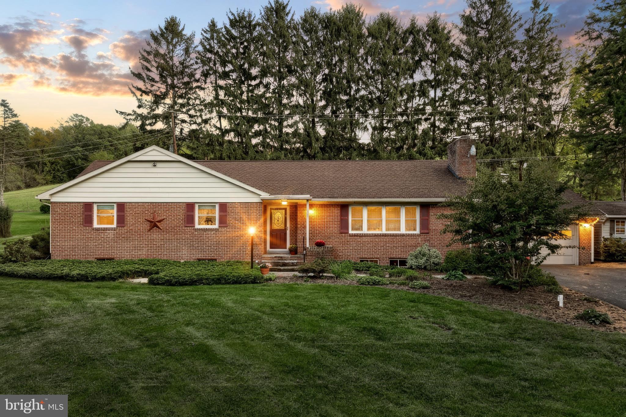 5200 Rockery Road Spring Grove, PA 17362 - Photo 1 of 45 a front view of a house with a yard and trees