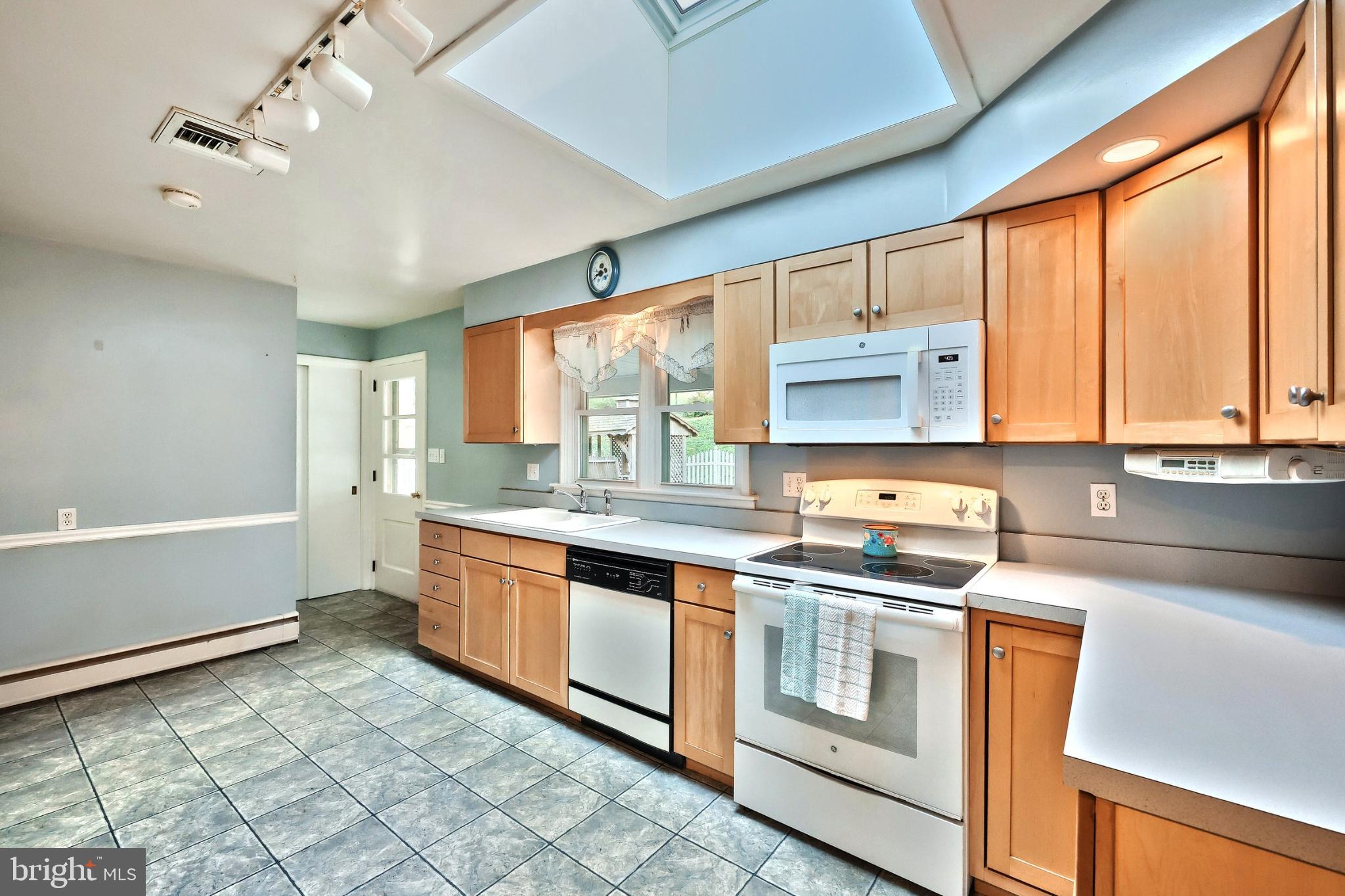 5200 Rockery Road Spring Grove, PA 17362 - Photo 15 of 45 a kitchen with stainless steel appliances granite countertop a stove and a sink
