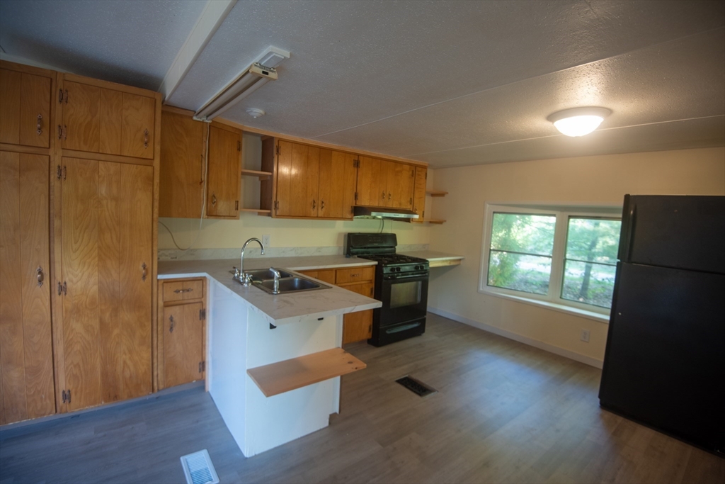 20 Dana Road Barre, MA 01005 - Photo 13 of 38 a kitchen with stainless steel appliances granite countertop a sink stove and refrigerator