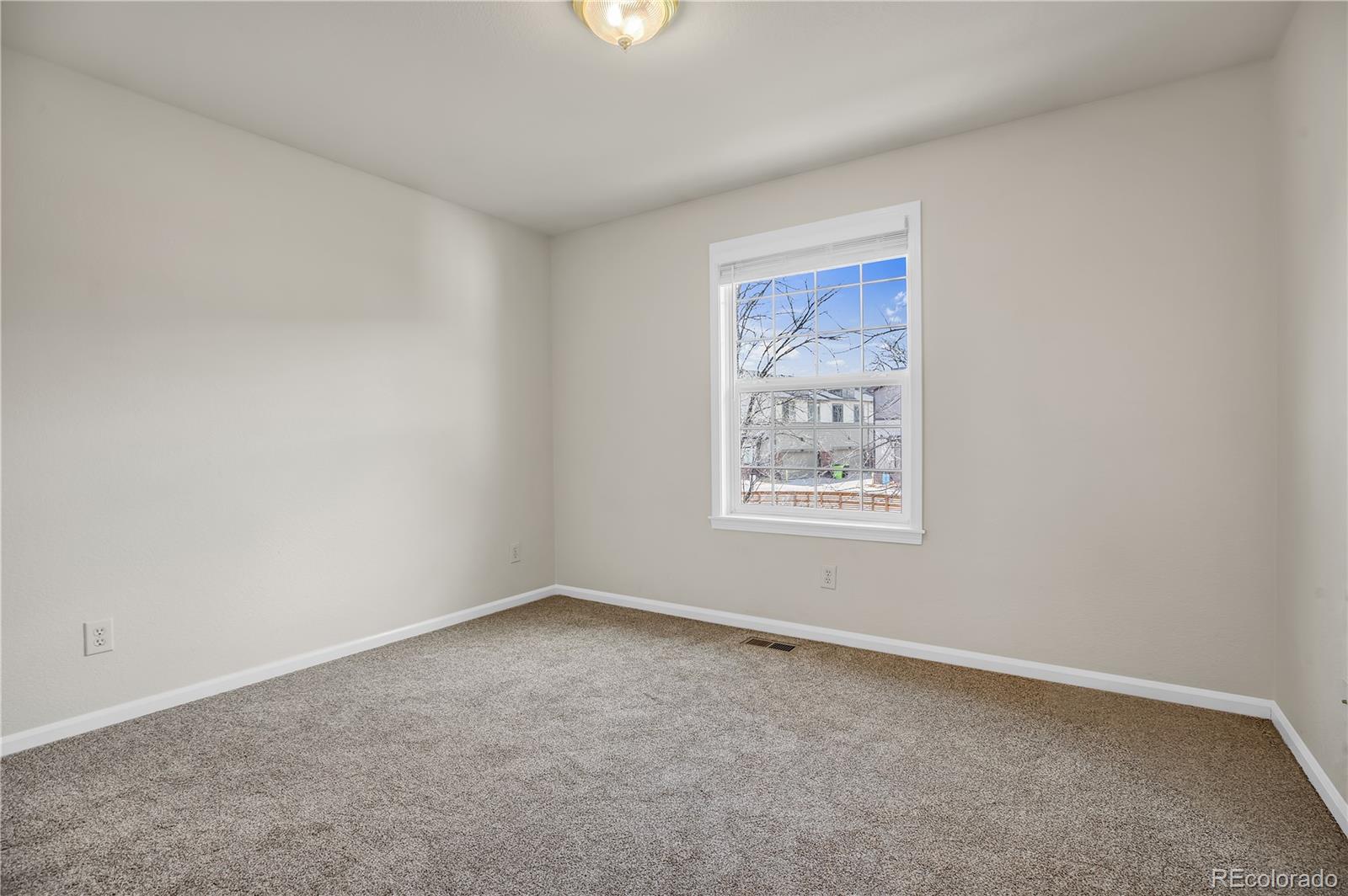 4505 Simms Court Wheat Ridge, CO 80033 - Photo 25 of 37 an empty room with a window