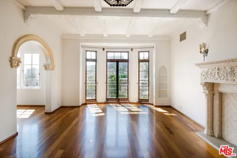 a view of an entryway with wooden floor