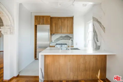 a view of kitchen with wooden floor
