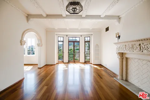 a view of an entryway with wooden floor