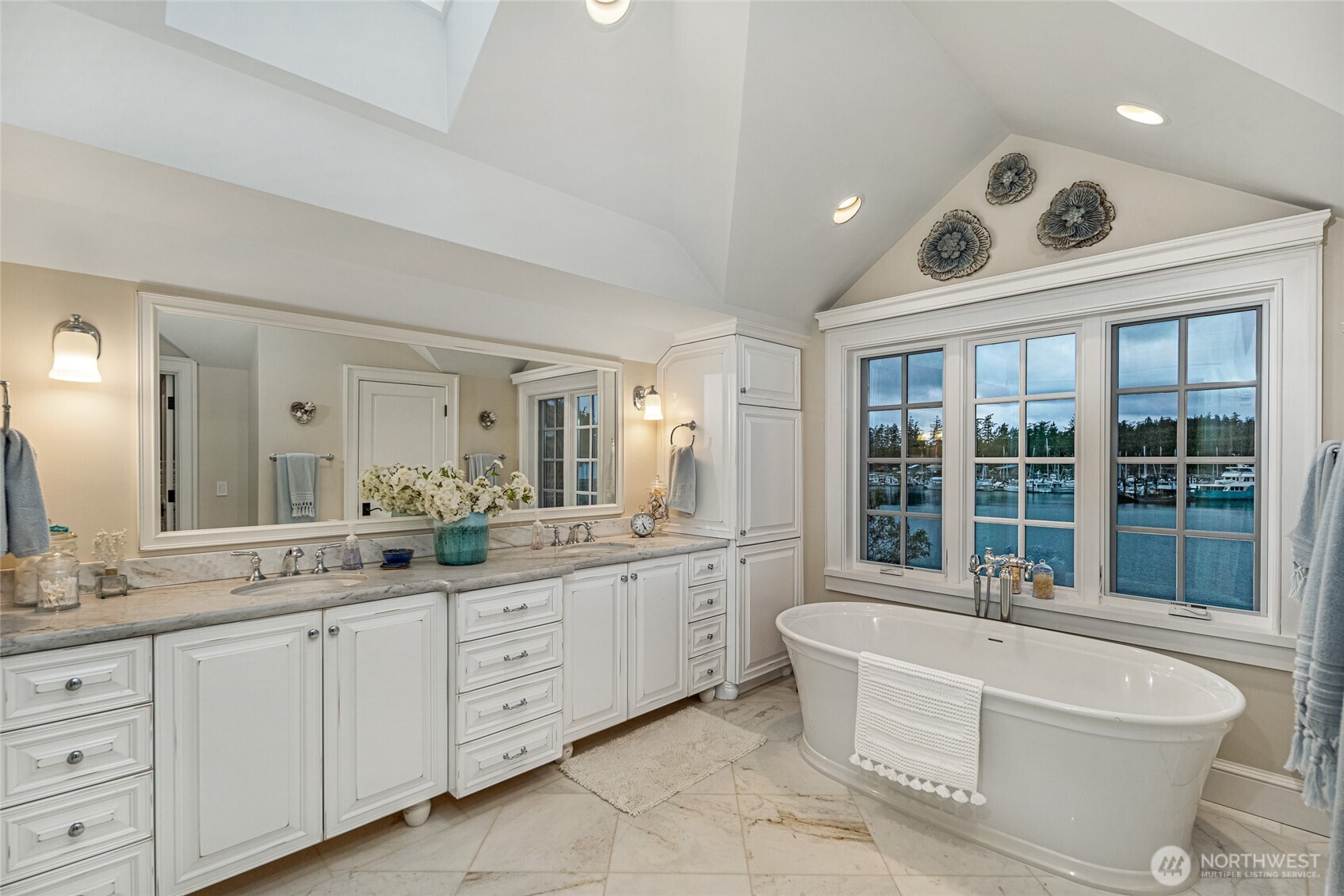 95 Laurel Point Lane Friday Harbor, WA 98250 - Photo 18 of 40 a large white bathroom with a large tub sink and mirror