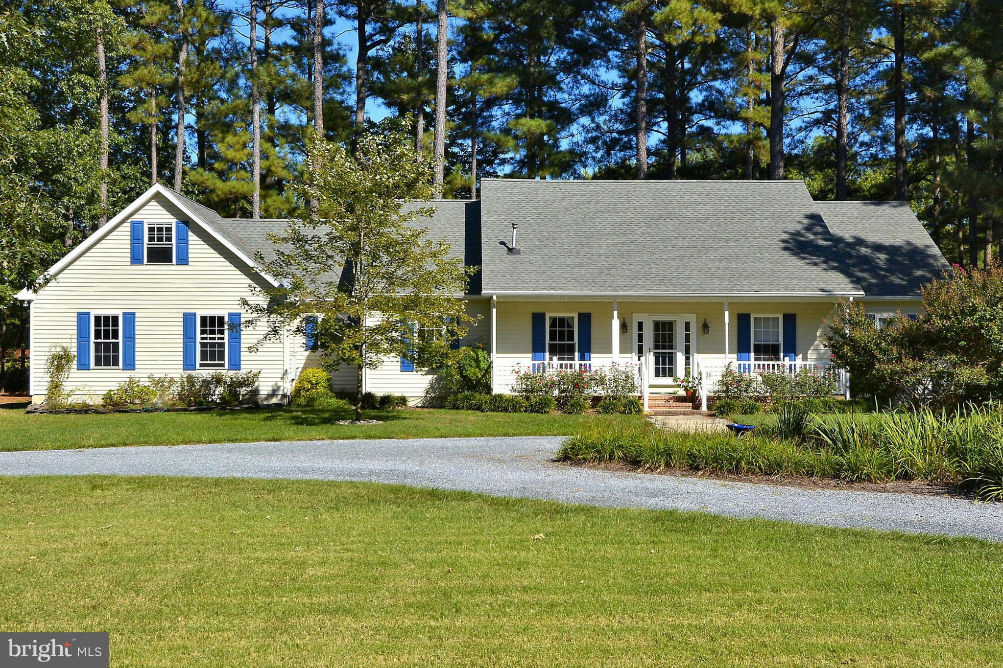 24100 Forest Pond Road St. Michaels, MD 21663 - Photo 1 of 20 a front view of a house with a yard