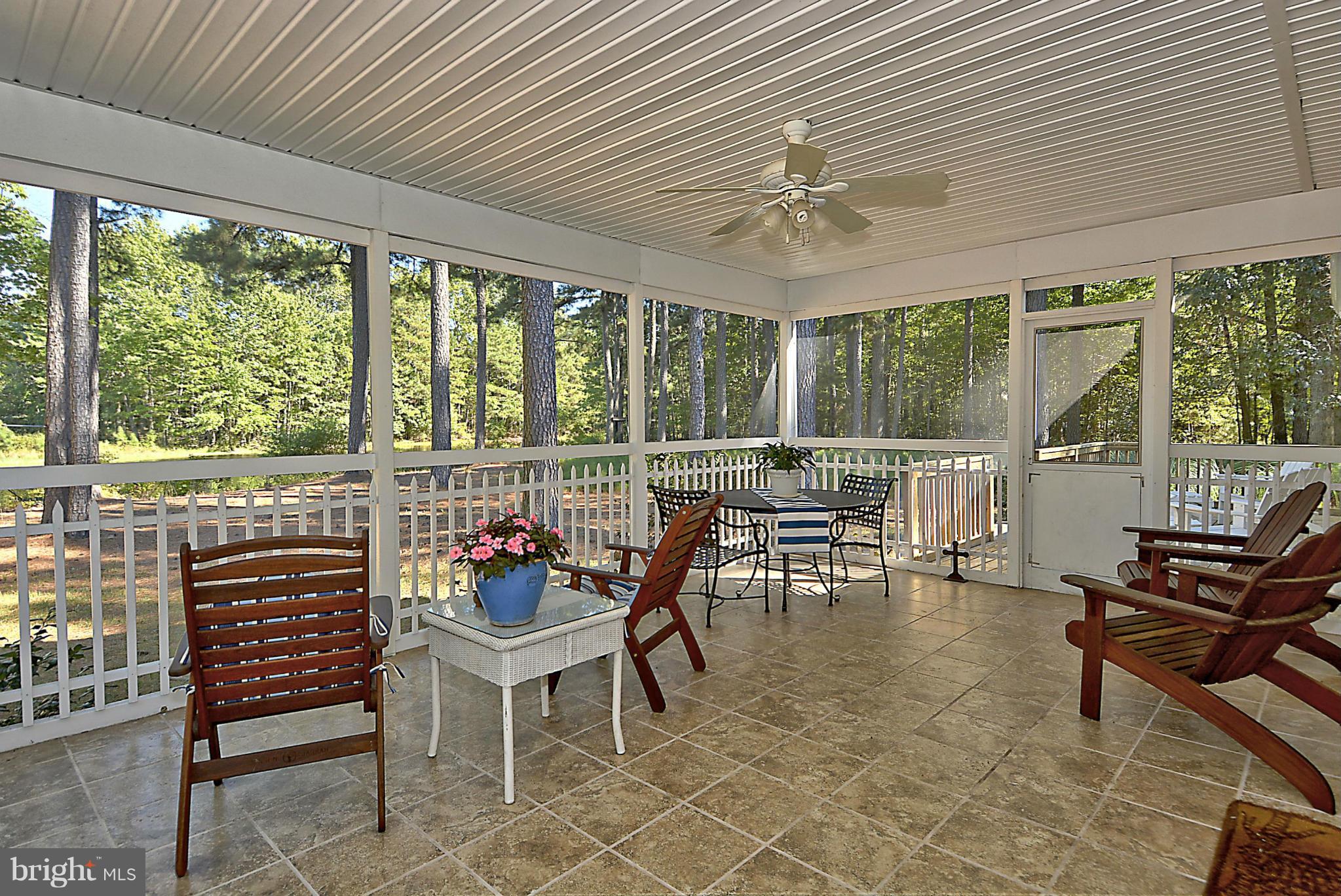 24100 Forest Pond Road St. Michaels, MD 21663 - Photo 11 of 20 a dining room with furniture water view and a large window