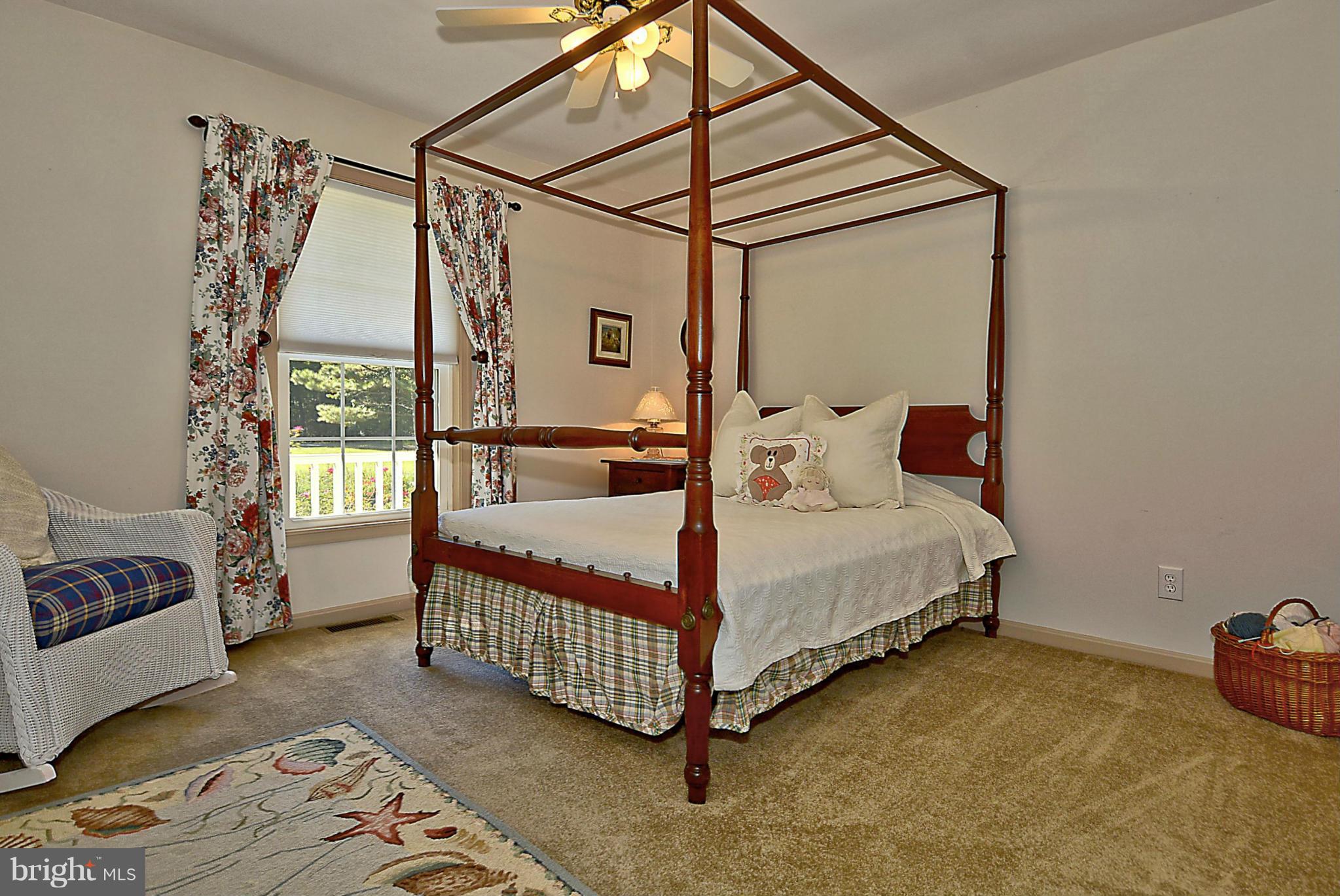 24100 Forest Pond Road St. Michaels, MD 21663 - Photo 16 of 20 a bedroom with a bed and a window