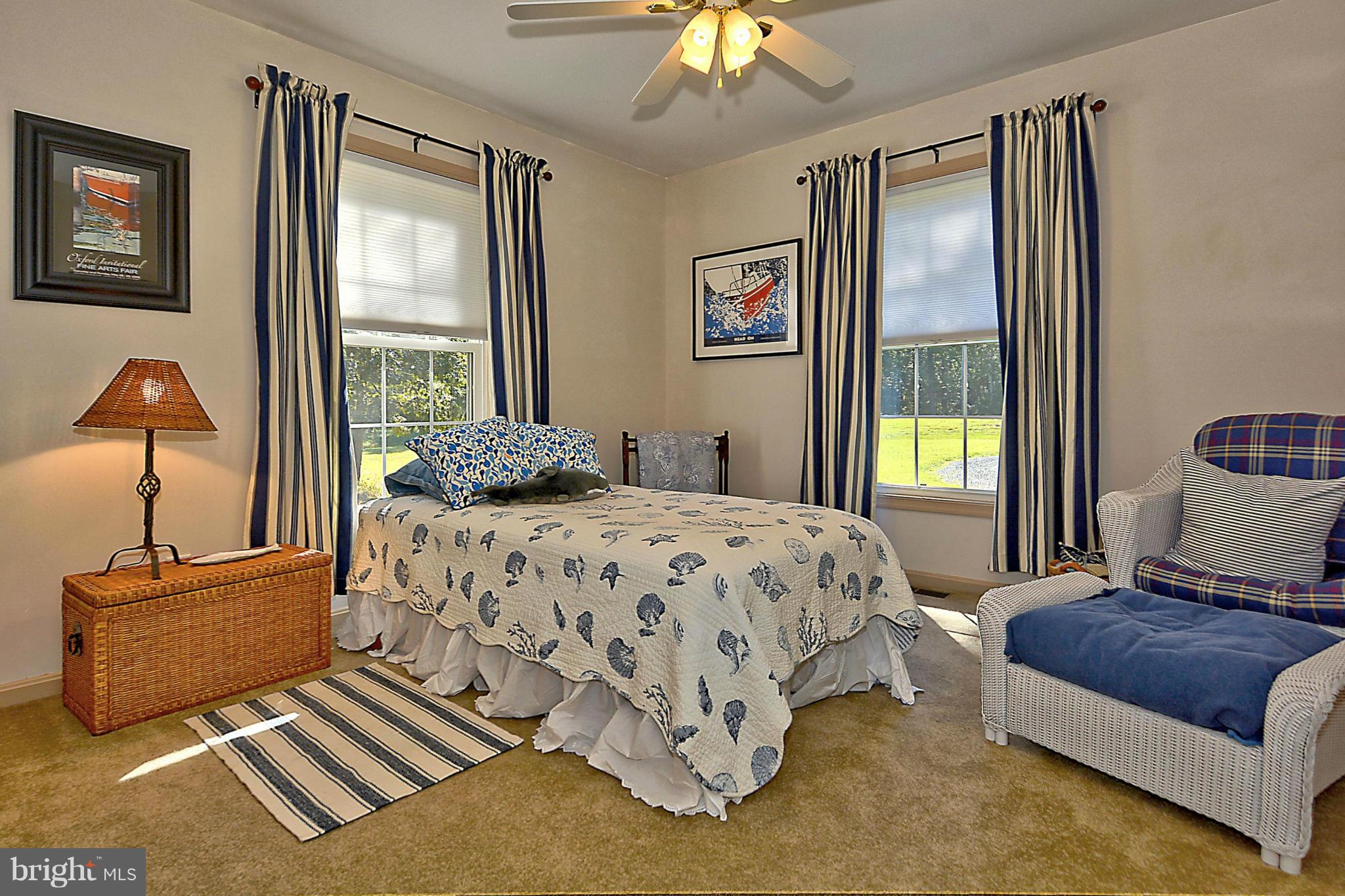 24100 Forest Pond Road St. Michaels, MD 21663 - Photo 17 of 20 a bedroom with a bed and window