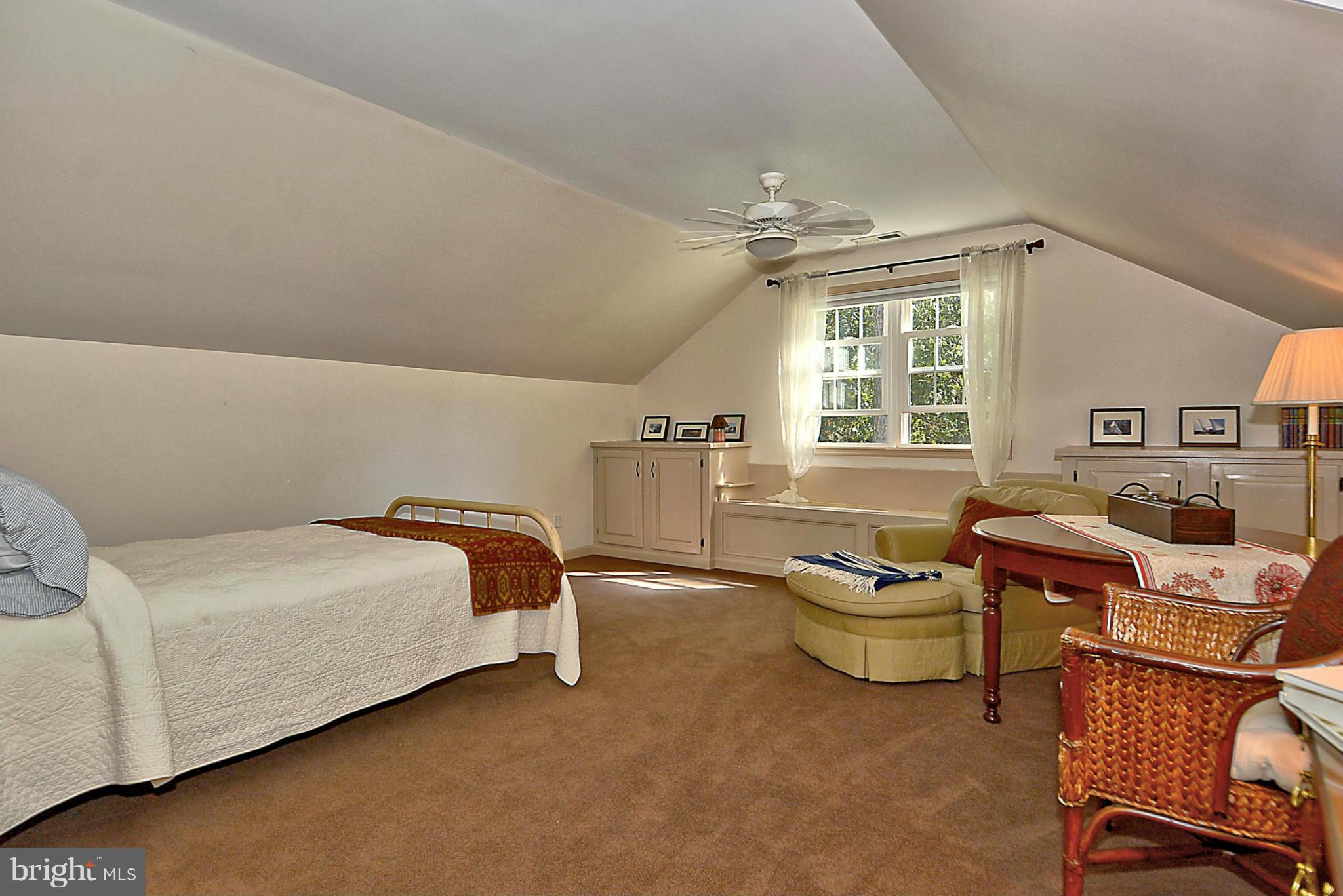 24100 Forest Pond Road St. Michaels, MD 21663 - Photo 18 of 20 a bedroom with furniture and a window