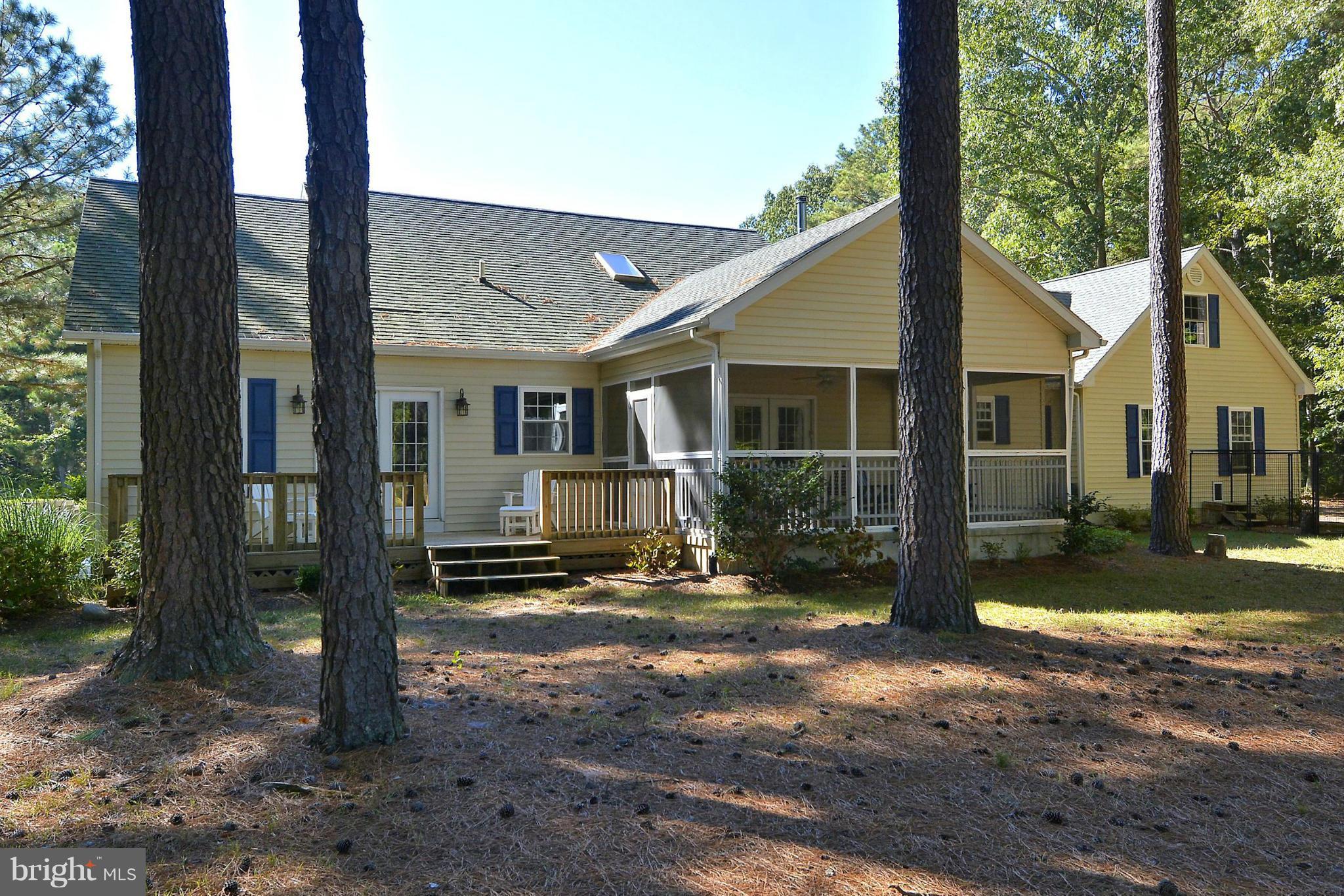 24100 Forest Pond Road St. Michaels, MD 21663 - Photo 3 of 20 a view of a house with backyard and sitting area