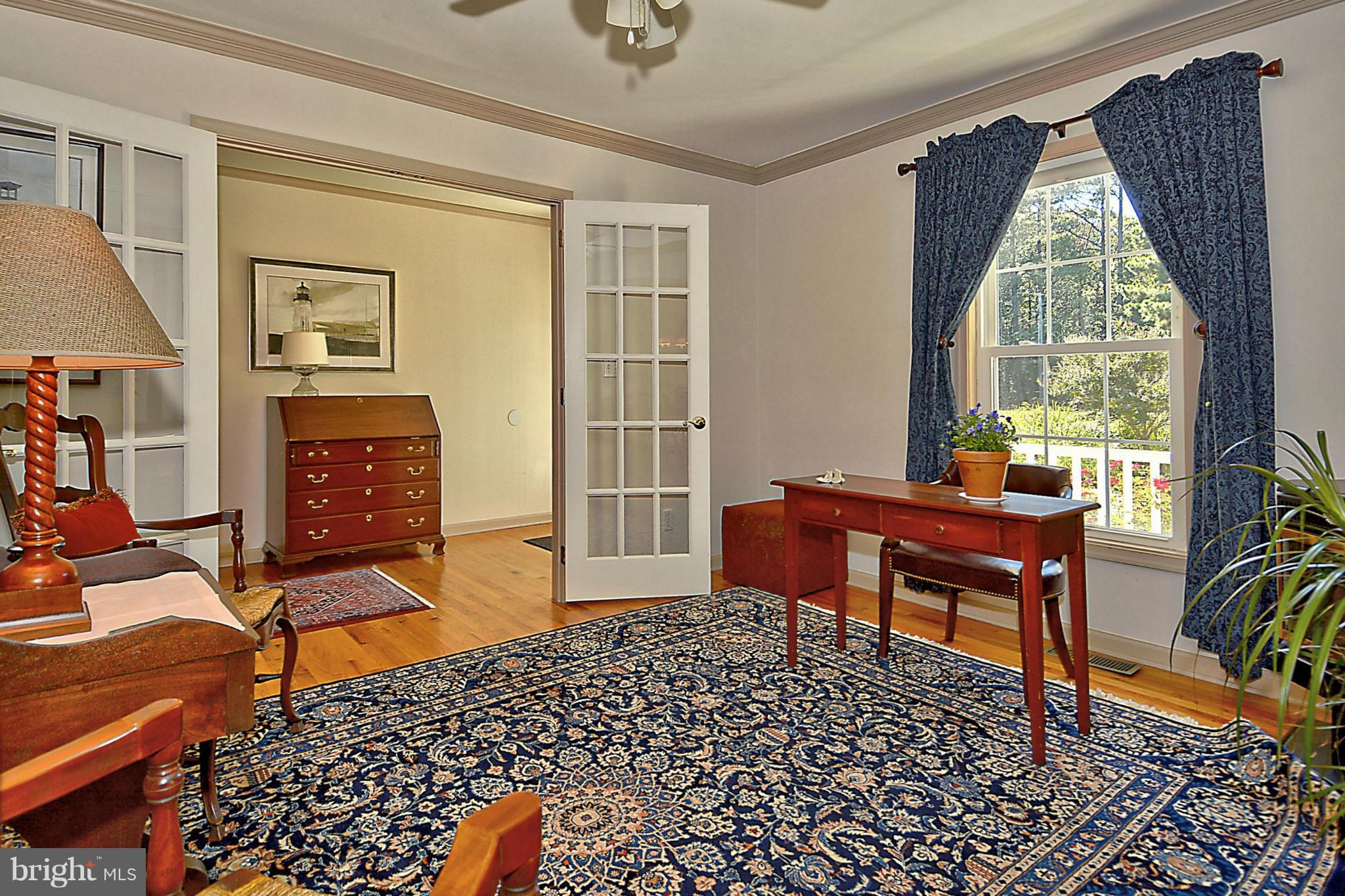 24100 Forest Pond Road St. Michaels, MD 21663 - Photo 5 of 20 a living room with furniture and a window