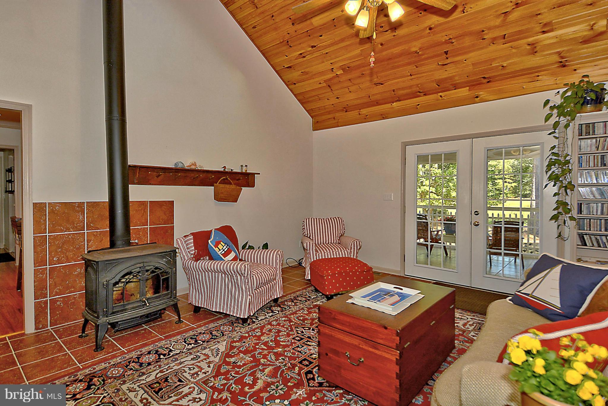 24100 Forest Pond Road St. Michaels, MD 21663 - Photo 9 of 20 a living room with furniture a rug and a window