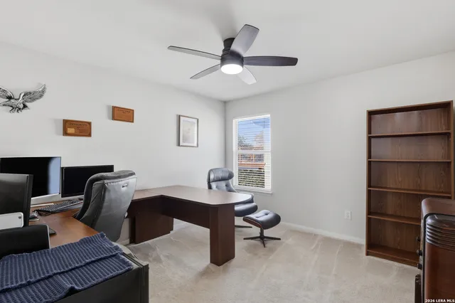 a workspace with furniture and window