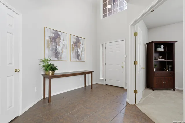 a view of an empty room with a closet