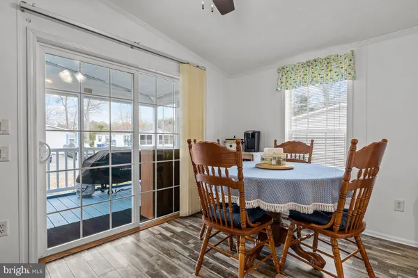 a living room with furniture a fireplace and a lamp