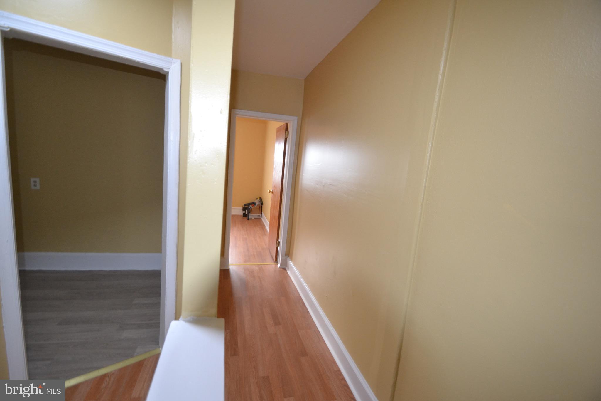 2002 North 56th Street, Unit 2 Philadelphia, PA 19131 - Photo 17 of 18 a view of a hallway with wooden floor