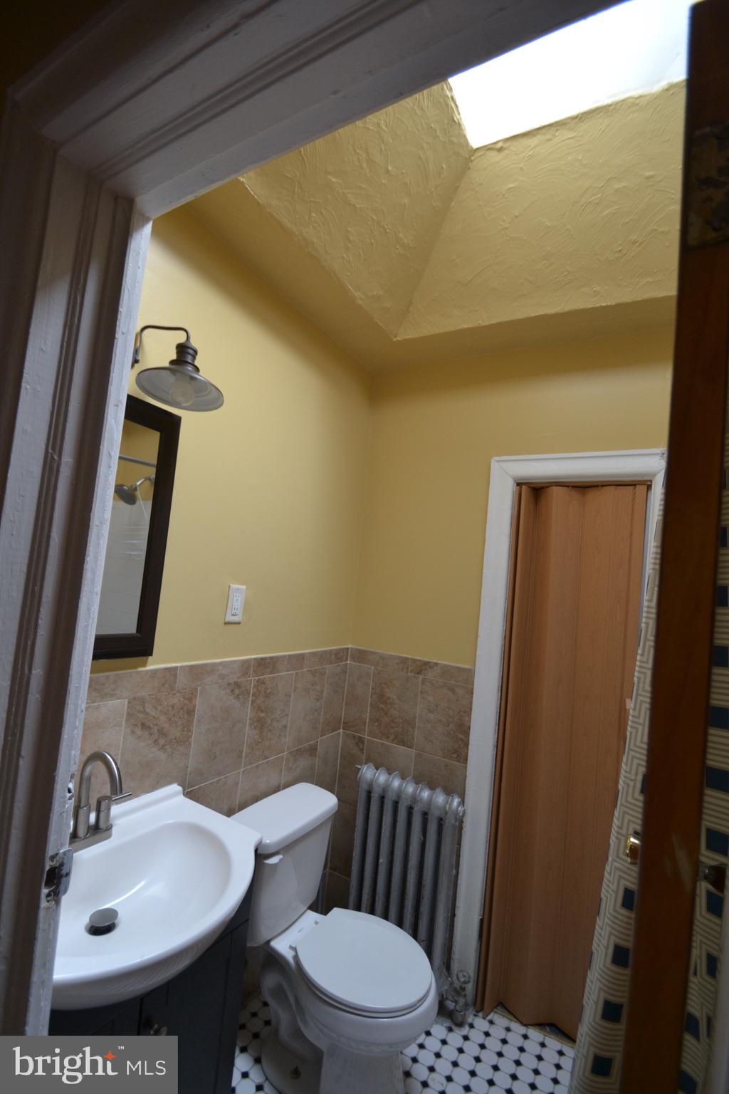 2002 North 56th Street, Unit 2 Philadelphia, PA 19131 - Photo 10 of 18 a bathroom with a sink and toilet