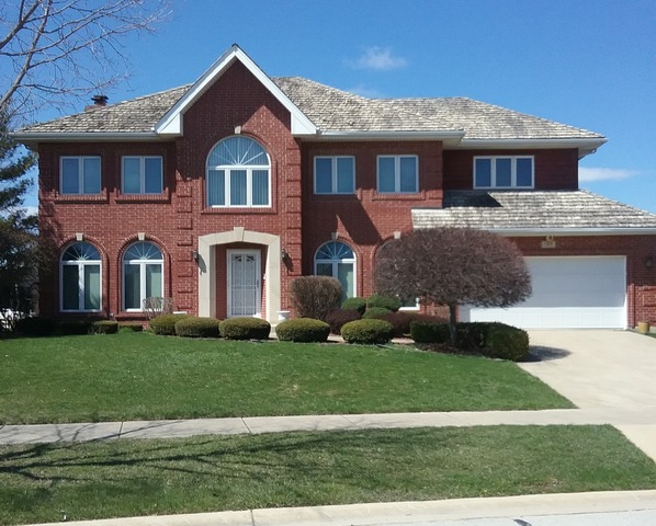 1211 Aspen Way Addison, IL 60101 - Photo 1 of 25 a front view of a house with a yard