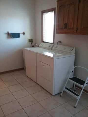 1211 Aspen Way Addison, IL 60101 - Photo 23 of 25 a room with washing machine and cabinets