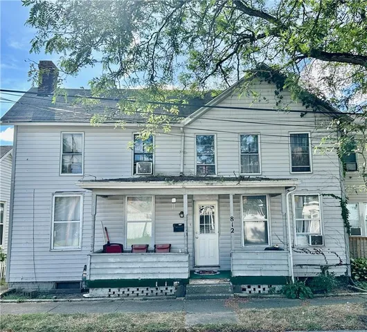 front view of a house with a yard
