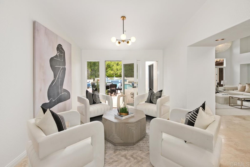 3303 Bumann Road Encinitas, CA 92024 - Photo 11 of 50 a living room with furniture a chandelier and a mirror