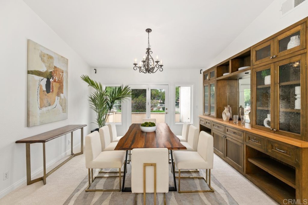 3303 Bumann Road Encinitas, CA 92024 - Photo 12 of 50 a view of a dining room with furniture window and outside view