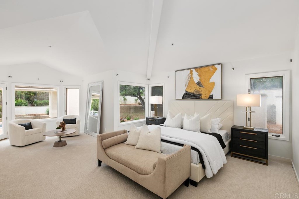 3303 Bumann Road Encinitas, CA 92024 - Photo 19 of 50 a spacious bedroom with a bed and glass window