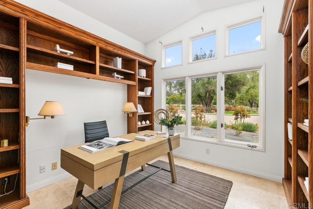 3303 Bumann Road Encinitas, CA 92024 - Photo 25 of 50 a living room with furniture a rug and a window