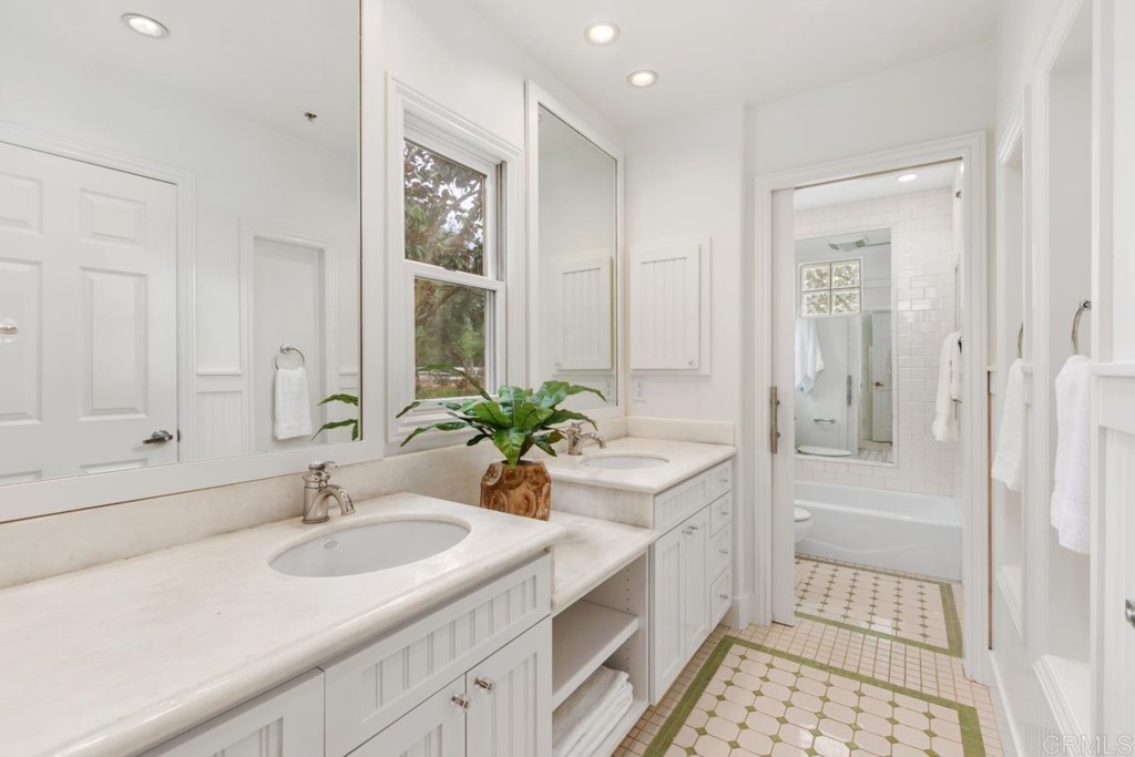 3303 Bumann Road Encinitas, CA 92024 - Photo 31 of 50 a bathroom with a tub sink and mirror