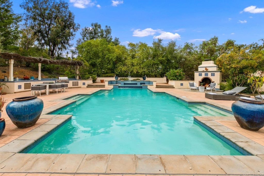 3303 Bumann Road Encinitas, CA 92024 - Photo 32 of 50 a view of a swimming pool with lounge chairs