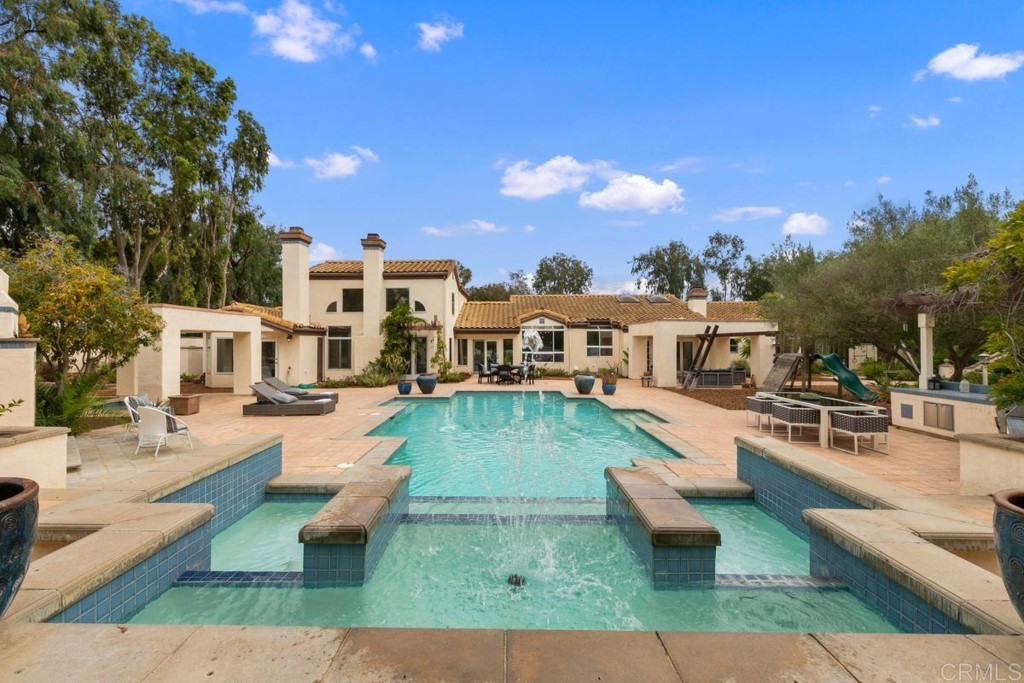 3303 Bumann Road Encinitas, CA 92024 - Photo 33 of 50 a view of a house with swimming pool and sitting area