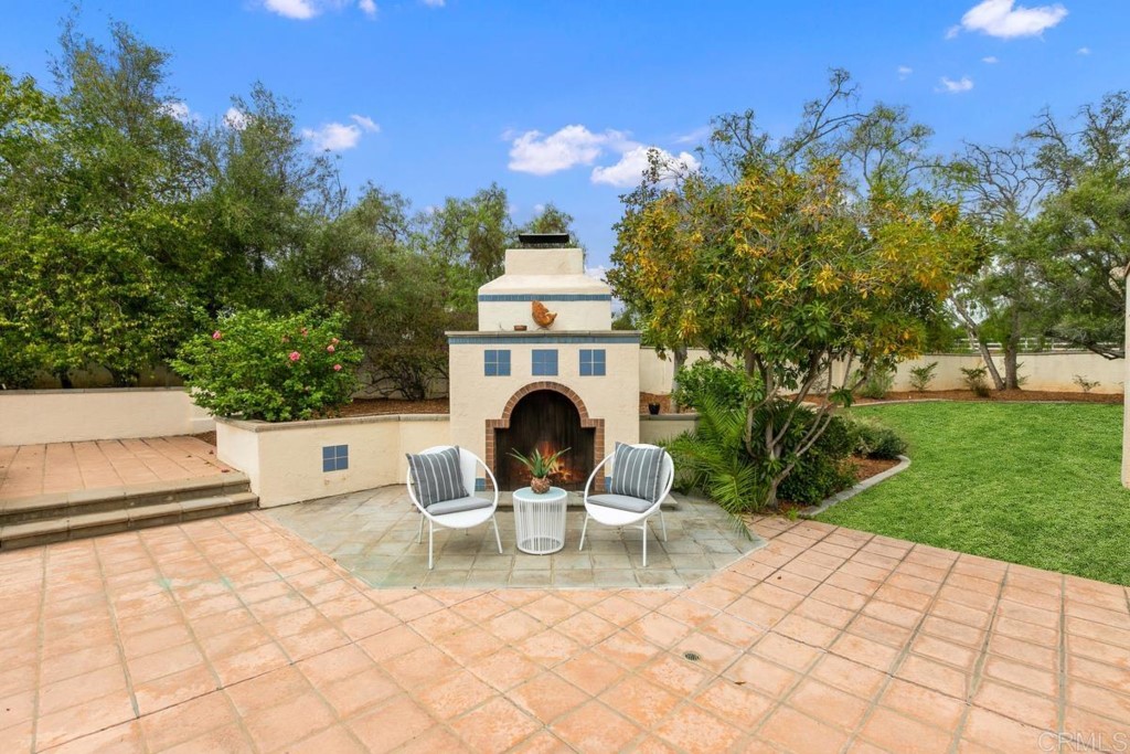 3303 Bumann Road Encinitas, CA 92024 - Photo 40 of 50 a view of a chair and tables in the garden
