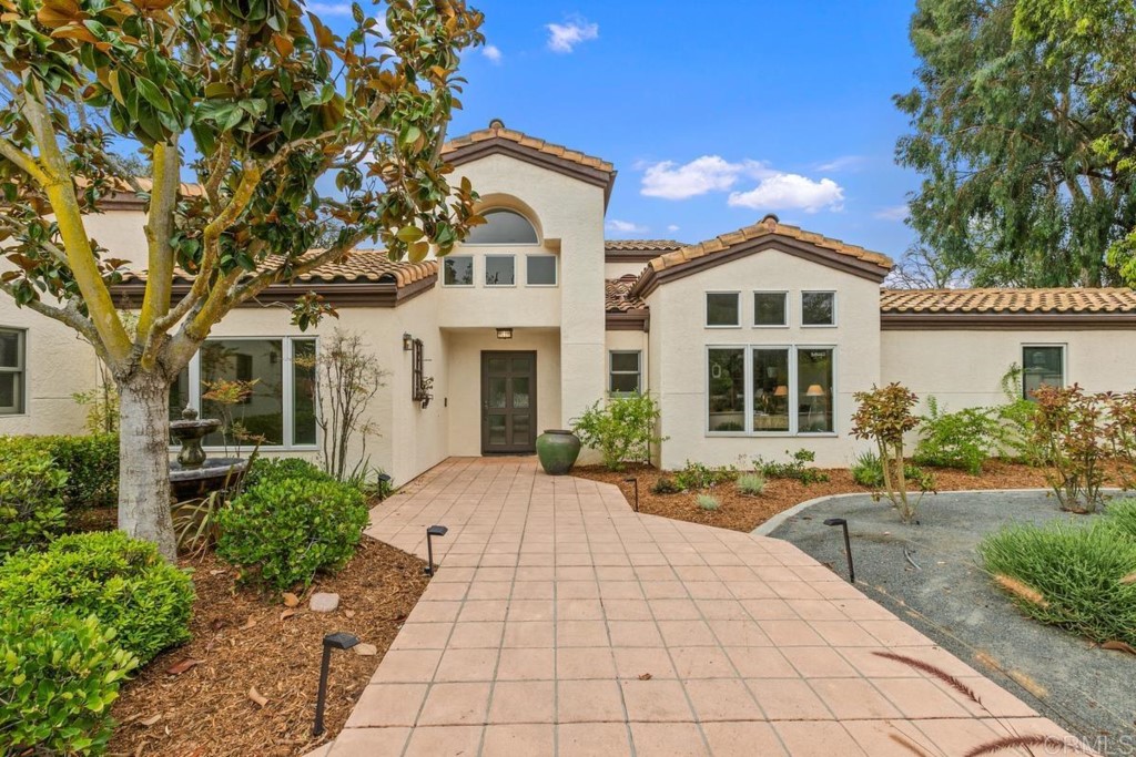 3303 Bumann Road Encinitas, CA 92024 - Photo 6 of 50 a front view of a house with garden