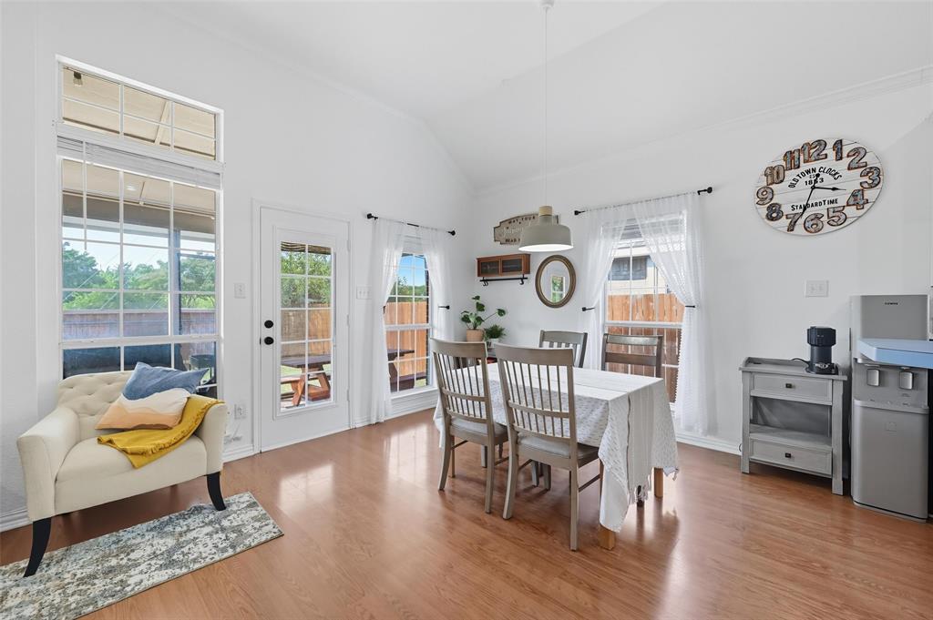 646 Huntington Lane Allen, TX 75002 - Photo 11 of 33 a view of a dining room with furniture a rug and wooden floor
