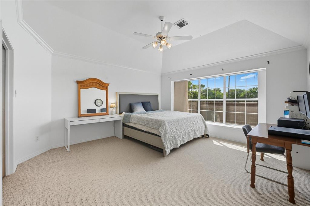 646 Huntington Lane Allen, TX 75002 - Photo 15 of 33 a bedroom with a bed and a table