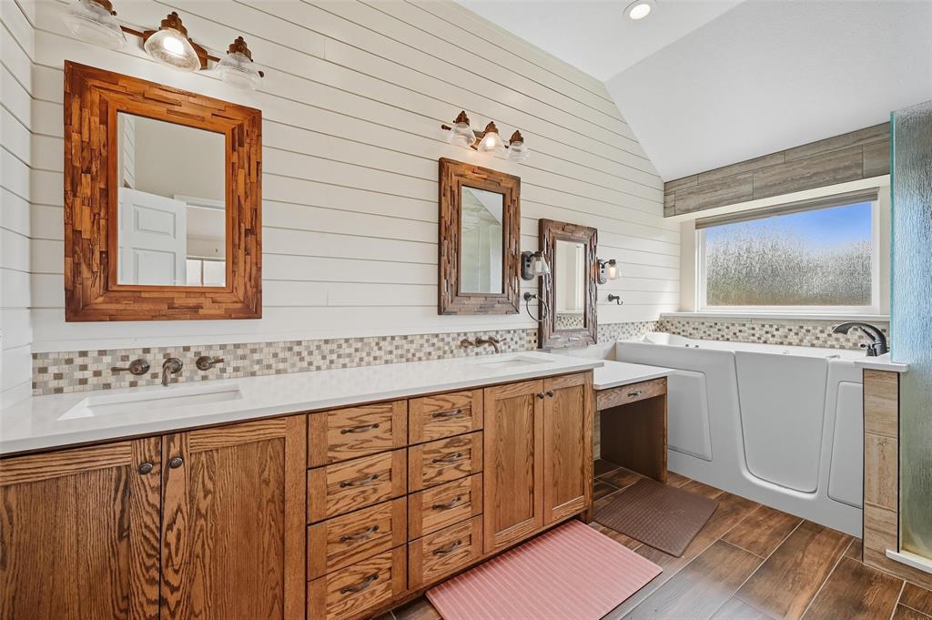 646 Huntington Lane Allen, TX 75002 - Photo 18 of 33 a bathroom with a sink vanity and mirror