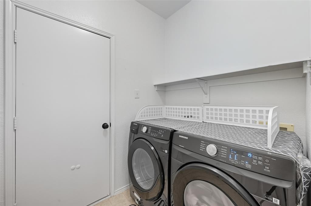646 Huntington Lane Allen, TX 75002 - Photo 25 of 33 a utility room with dryer and washer
