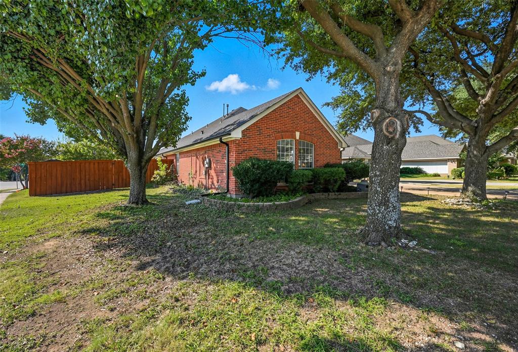 646 Huntington Lane Allen, TX 75002 - Photo 28 of 33 a front view of a house with garden