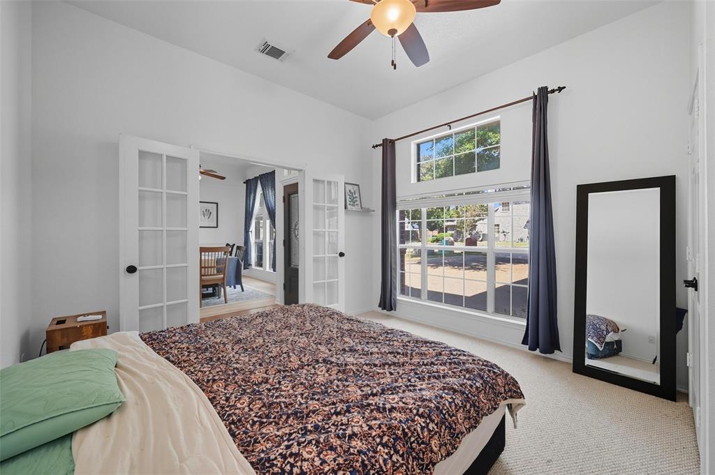 646 Huntington Lane Allen, TX 75002 - Photo 6 of 33 a bedroom with a large bed and a large window