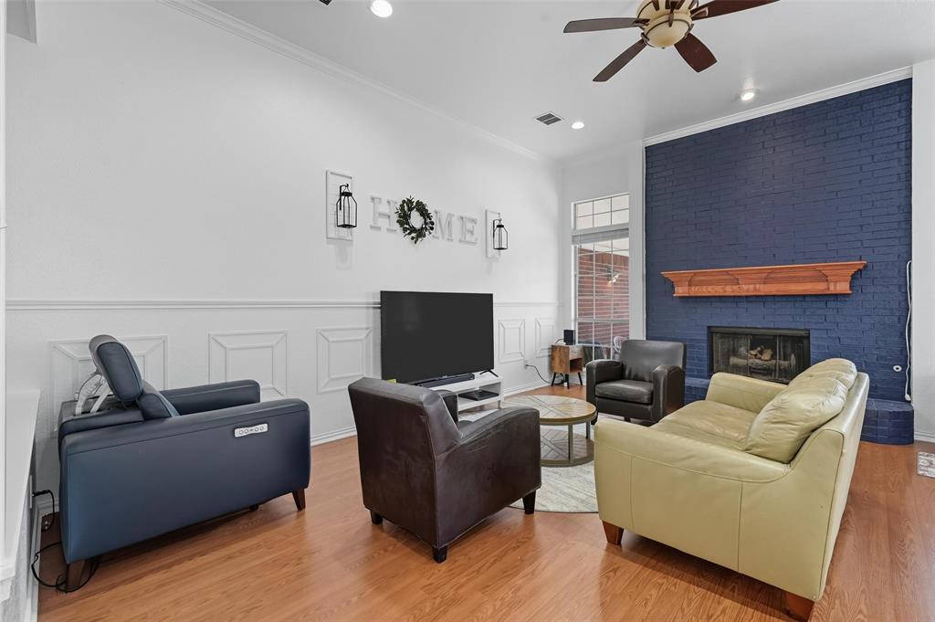 646 Huntington Lane Allen, TX 75002 - Photo 8 of 33 a living room with furniture and a flat screen tv
