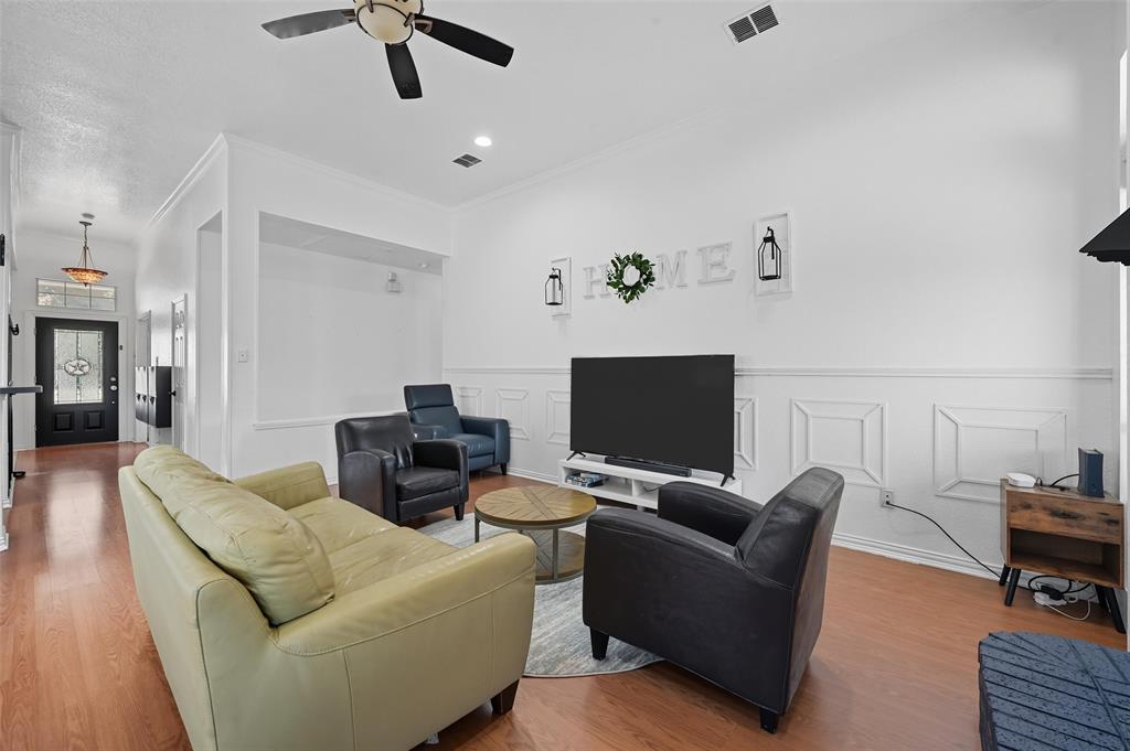 646 Huntington Lane Allen, TX 75002 - Photo 9 of 33 a living room with furniture and a flat screen tv